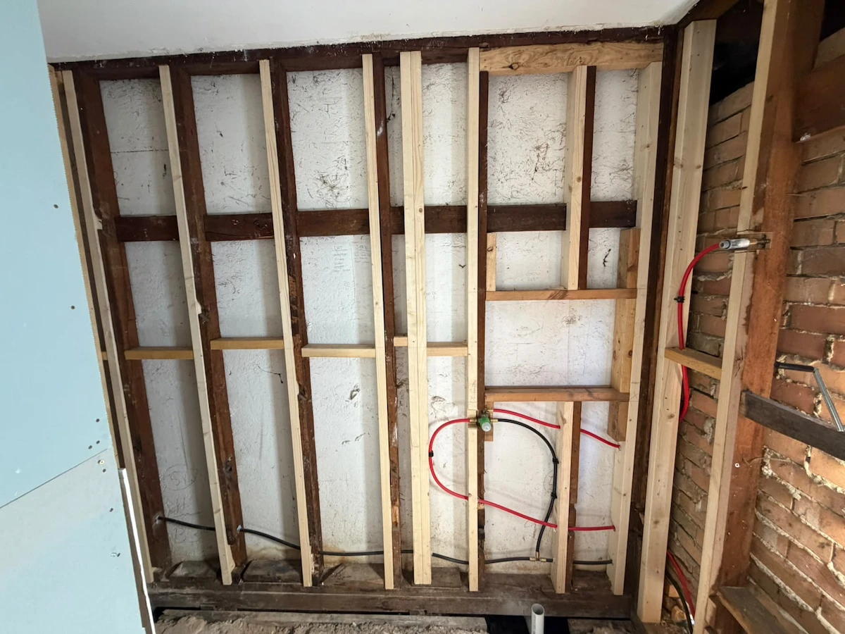Timber wall battens and plumbing rough-in during the Fawkner bathroom renovation