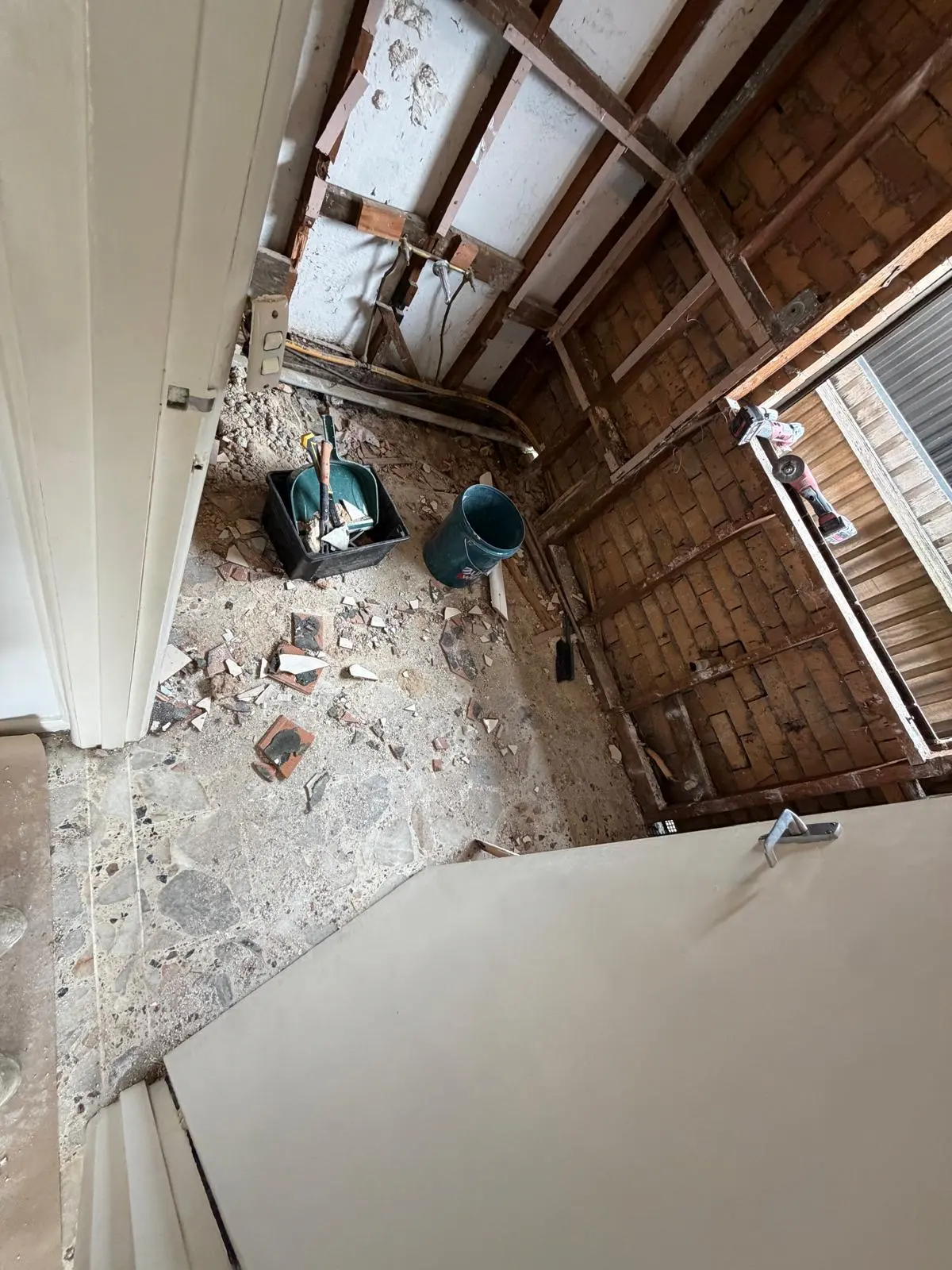 Fawkner bathroom demolition with existing timber wall framing exposed