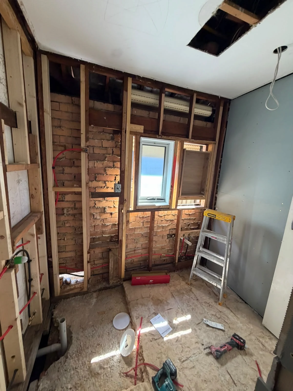 Plumbing and wall preparation during construction of the Fawkner bathroom