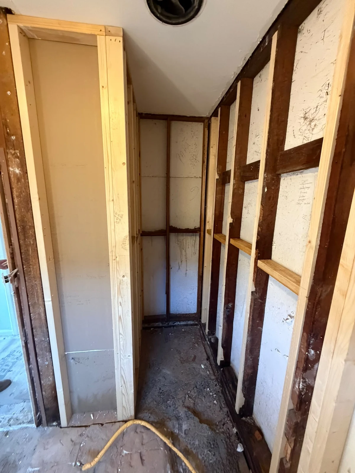 New timber-framed cavity created for the toilet and linen storage arrangement